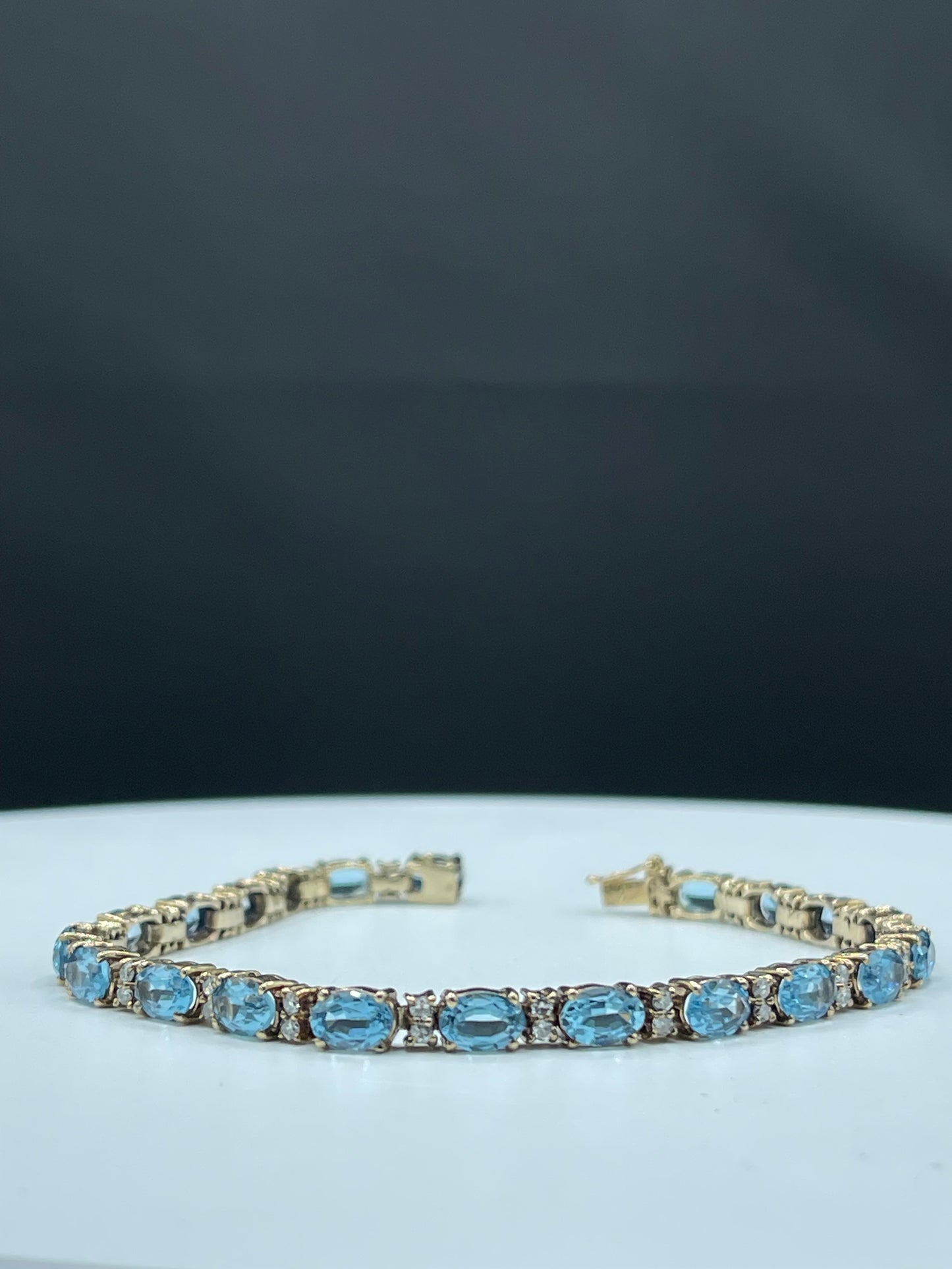 Vintage 13.92 Carat Blue Topaz & Diamond 14k Yellow Gold Tennis Bracelet