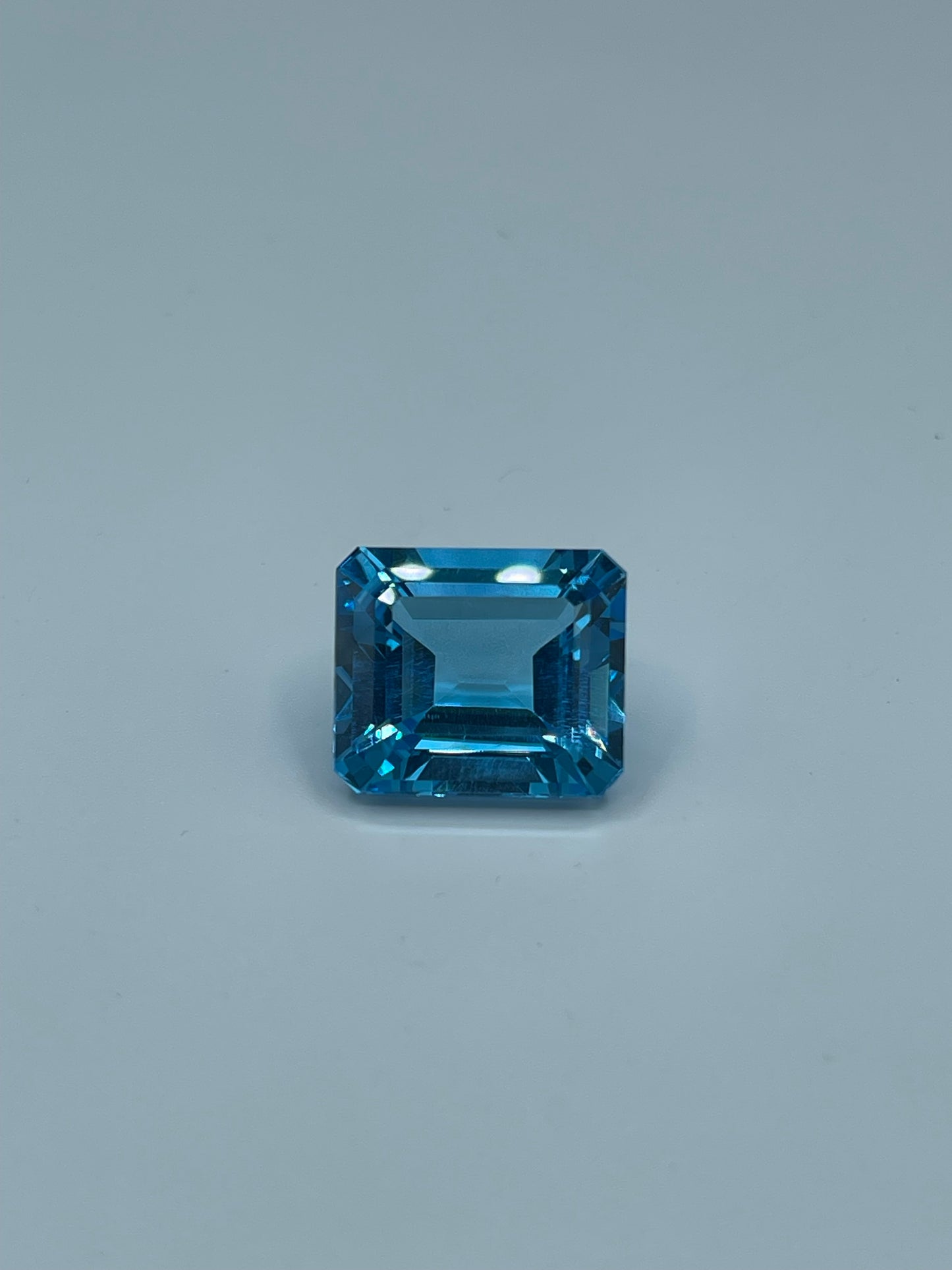 14.82 Carat Natural Blue Topaz Emerald Cut Loose Gemstone (15.1 x 13 x 7.9 MM)