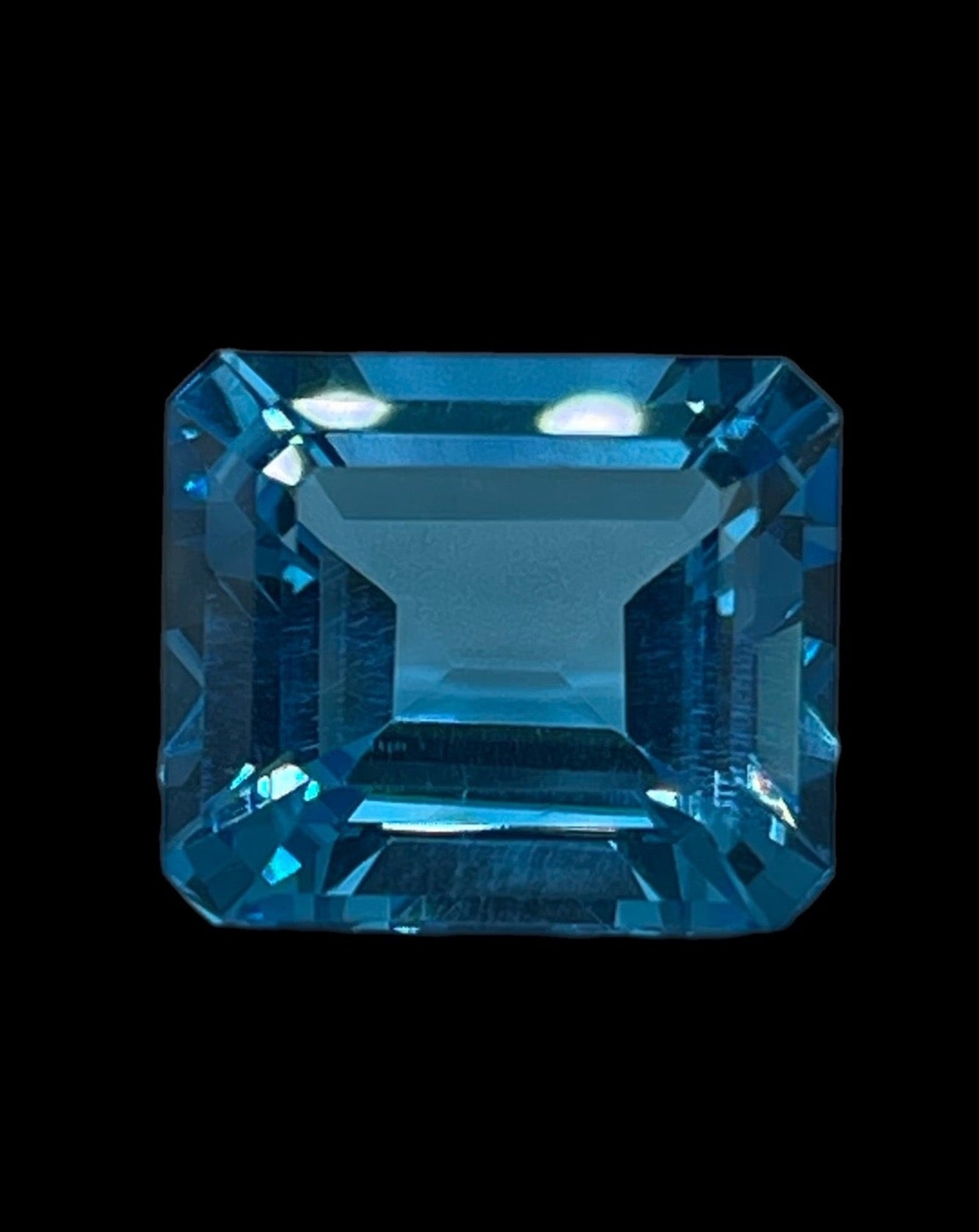 14.82 Carat Natural Blue Topaz Emerald Cut Loose Gemstone (15.1 x 13 x 7.9 MM)