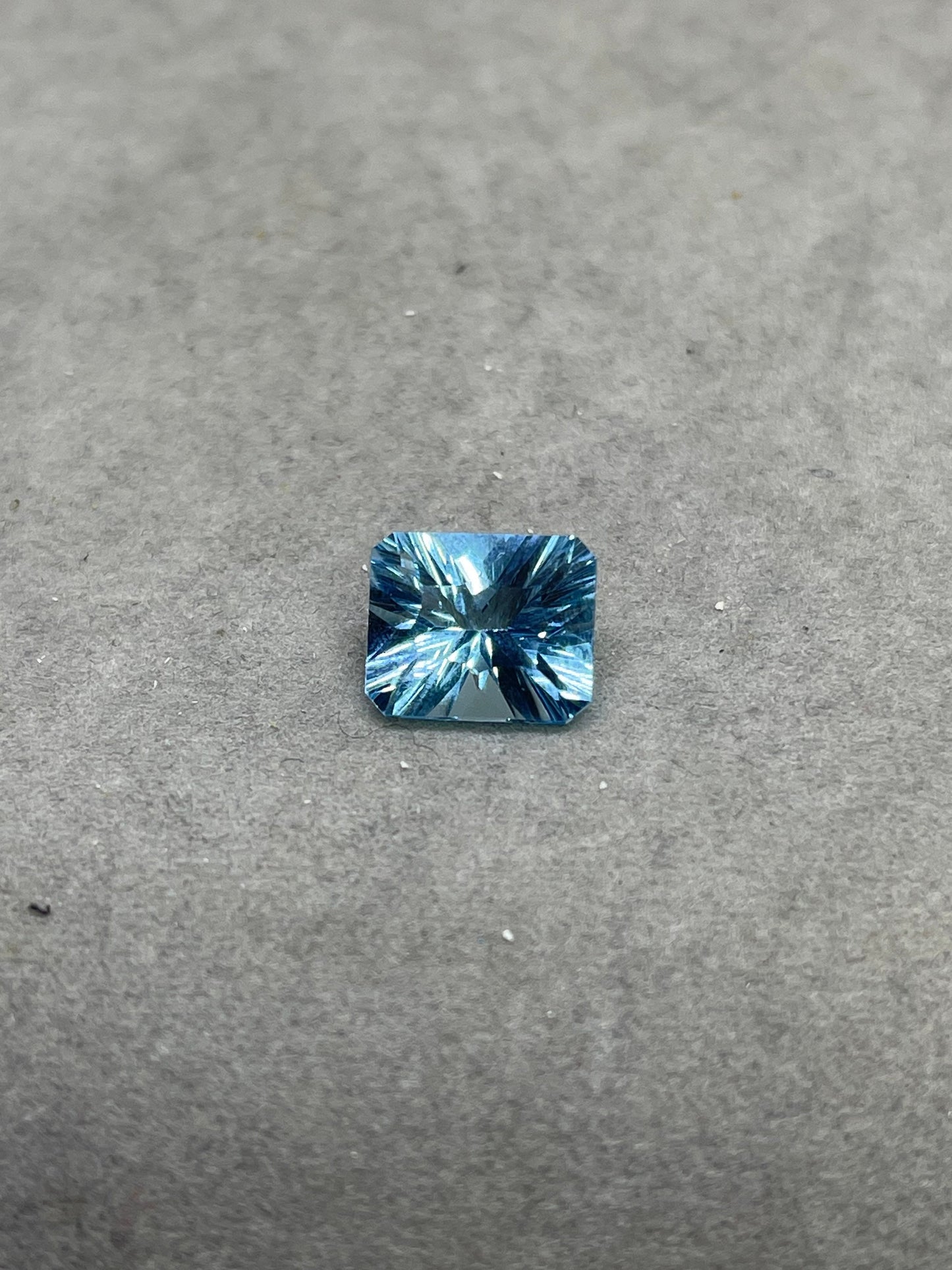 Laser Concave Cut Swiss Blue Topaz 12x10x7 Emerald Cut Loose Gemstone
